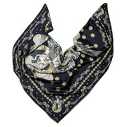streetart-silk-scarf-paris-by-mocomoco-berlin-artist-madame-moustache-motif-collage-with-heads-of-women-black-gold-140x140cm-elegantly-folded in-bird-wing-shape