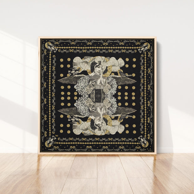silk-scarf-street-art-paris-artist-madame-moustache-interior-edition-by-mocomoco-berlin-scarf-with-collage-with-heads-of-women-black-gold-sewn-on-canvas-and-framed-in-light-wood-floating-frame-standing-in-a-living-room